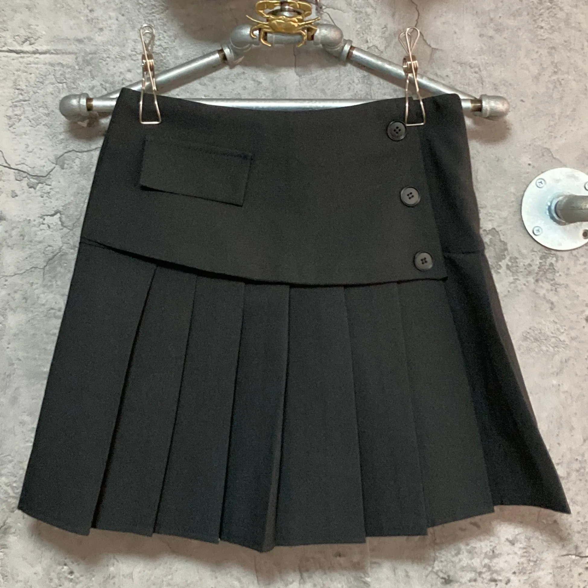 black pleated mini skirt