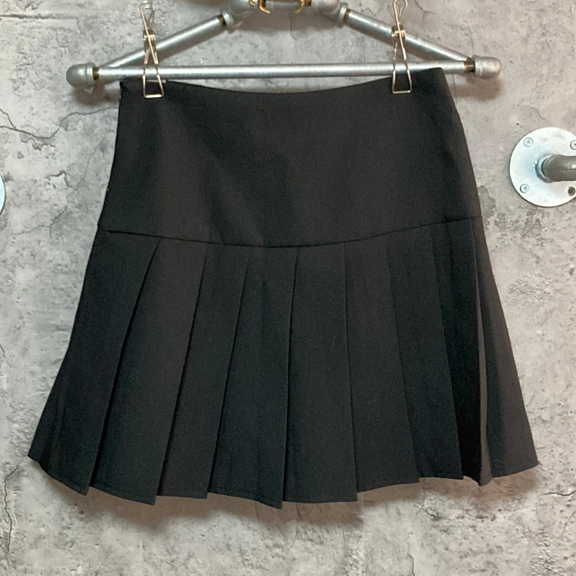 black pleated mini skirt