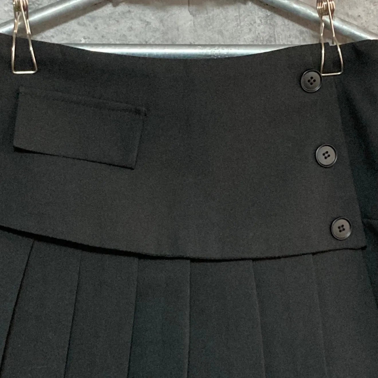 black pleated mini skirt